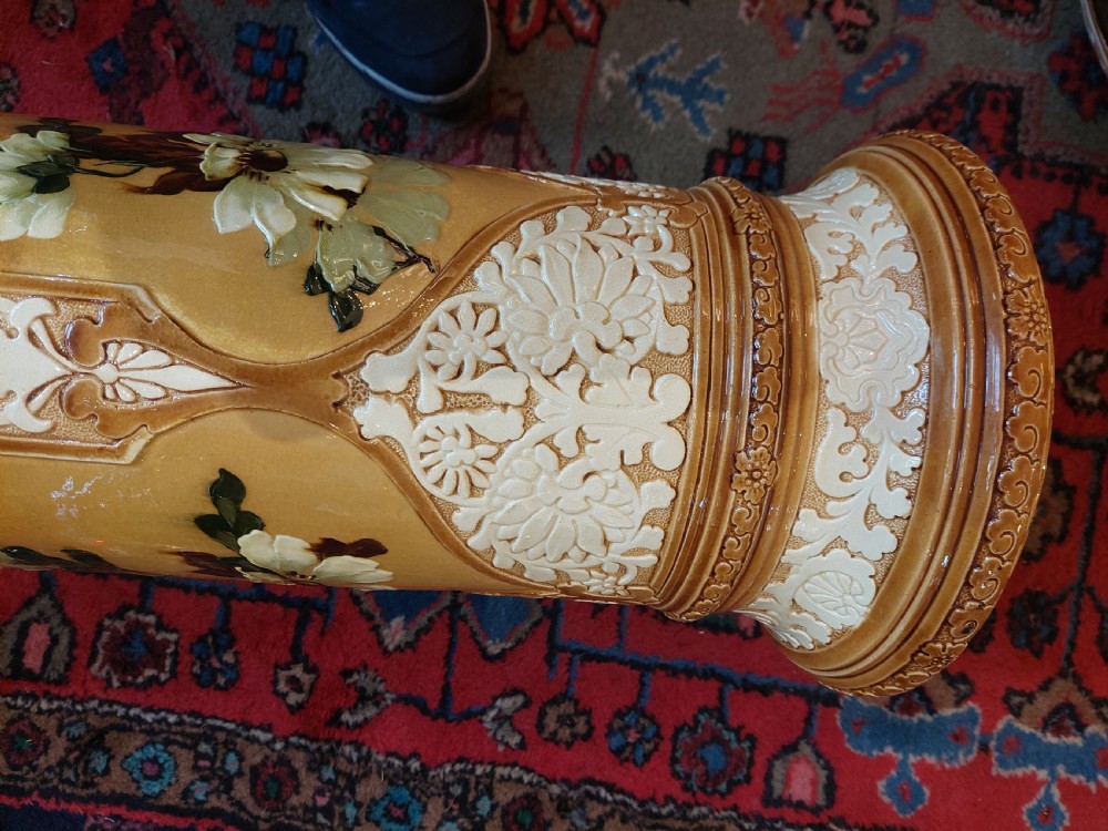 A Victorian Burmantofts majolica ceramic jardiniere and matching pedestal stand featuring painted floral panels and cream relief scrollwork on an ochre glaze. View VIII