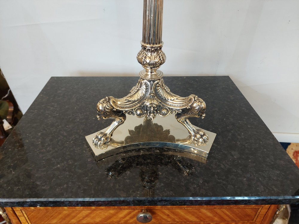 A late Victorian silver-plated oil lamp featuring a fluted column stem, a red cranberry glass reservoir, a brass burner, and a frosted etched glass shade. View III