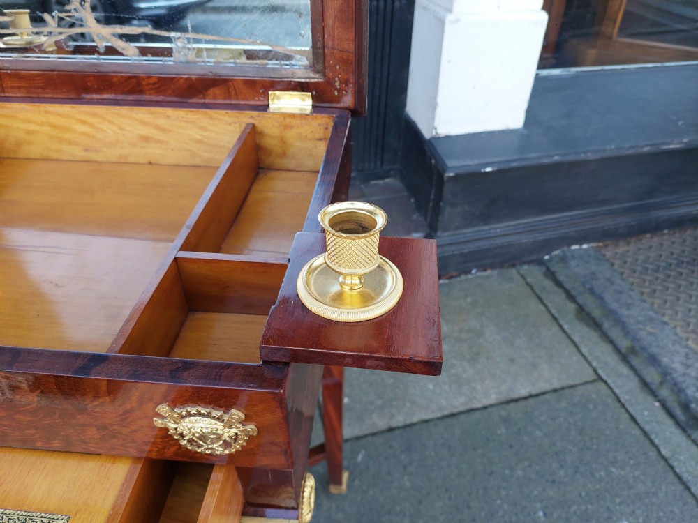 Late nineteenth-century French mahogany writing desk featuring an open mirrored lid, gilt bronze mounts, pull-out drawer with green velvet writing surface, and candle slides. View III