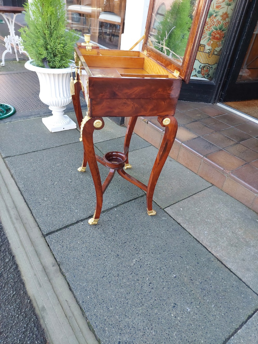 Late nineteenth-century French mahogany writing desk featuring an open mirrored lid, gilt bronze mounts, pull-out drawer with green velvet writing surface, and candle slides. View VII