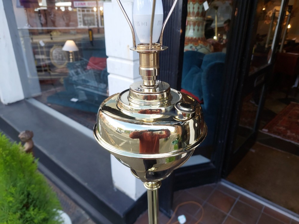 A Victorian Neoclassical brass floor lamp featuring a fluted column shaft, Corinthian capital detail, stepped base on claw feet, and a cream fringed fabric shade. View VIII
