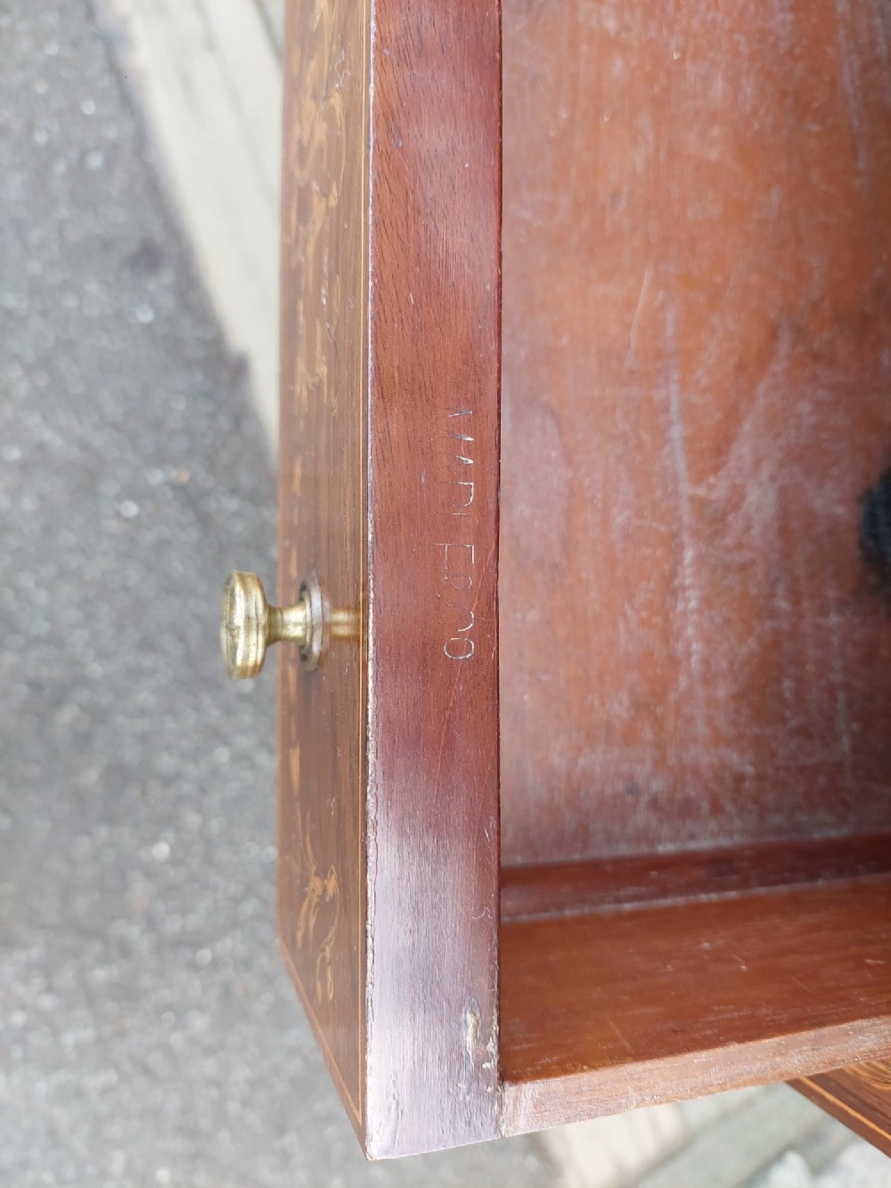 Late Victorian inlaid mahogany writing desk featuring an upper mirror-backed superstructure with brass gallery, leather writing surface, floral marquetry, and tapered legs on castors. View VII