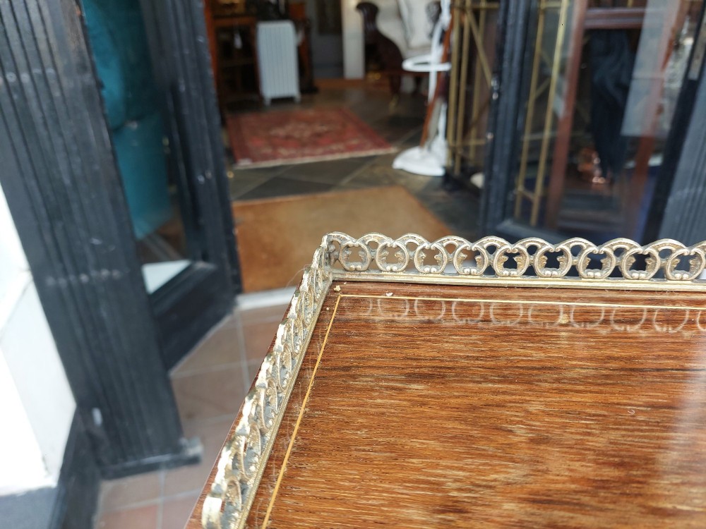 Late Victorian inlaid mahogany writing desk featuring an upper mirror-backed superstructure with brass gallery, leather writing surface, floral marquetry, and tapered legs on castors. View XI