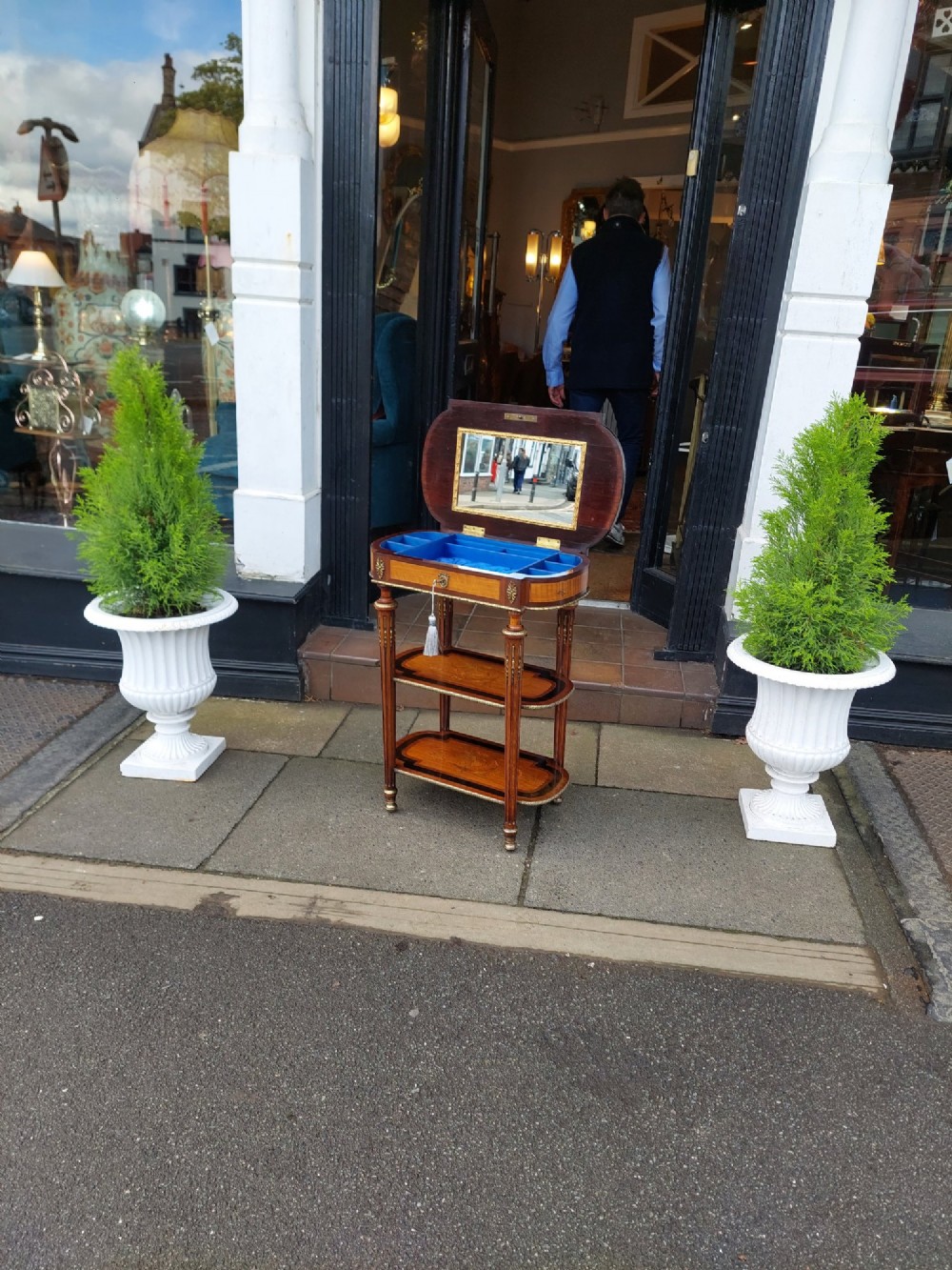 An antique Victorian marquetry whatnot table featuring floral inlay on the top surface, two lower tiers, fluted legs, and gilt-metal mounts. View XI