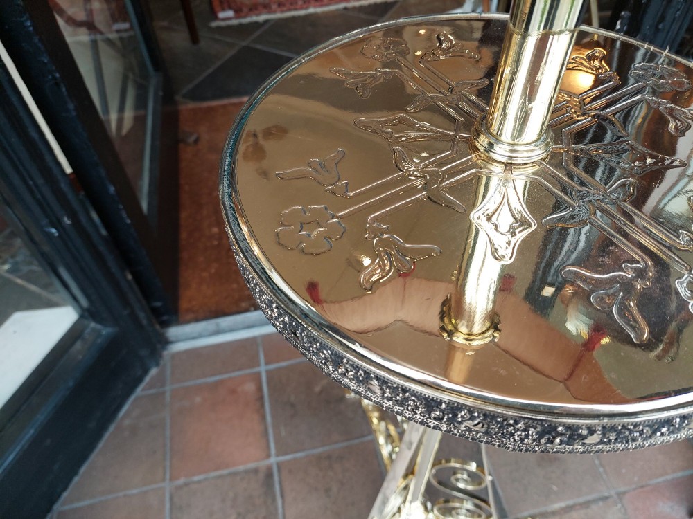 An Edwardian brass standard floor lamp featuring a scrollwork tripod base, an integrated circular tray table, and a fabric shade with fringe and tassels. View VIII