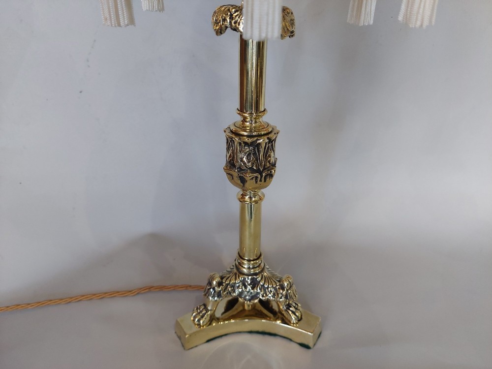 A pair of early 19th-century brass candlestick table lamps with claw feet and rose-coloured fringed fabric shades. View III