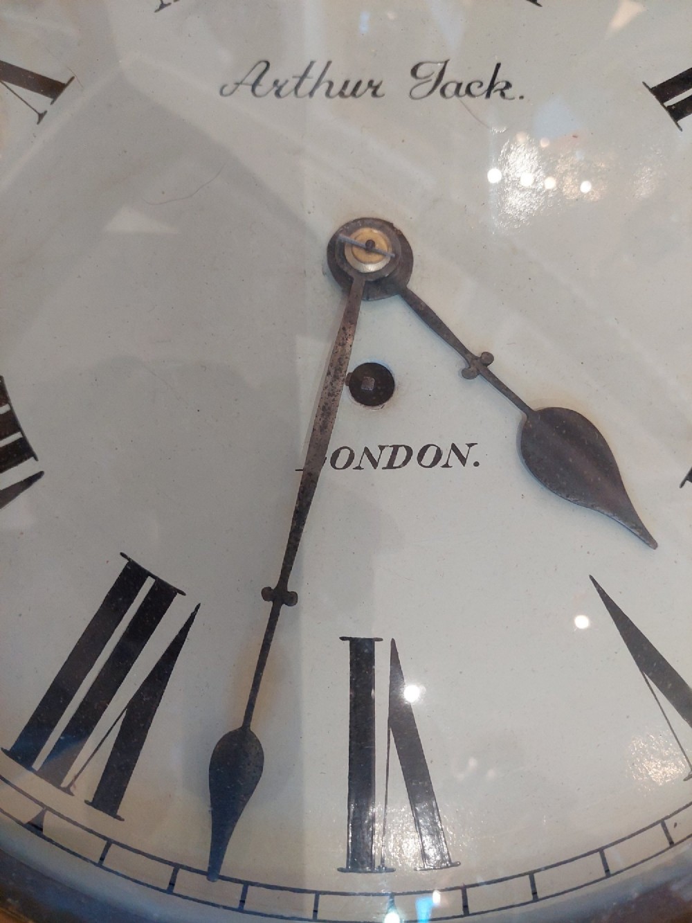A Victorian octagonal rosewood wall clock featuring intricate floral mother-of-pearl inlay, carved side scrolls, and an off-white dial with Roman numerals. View III