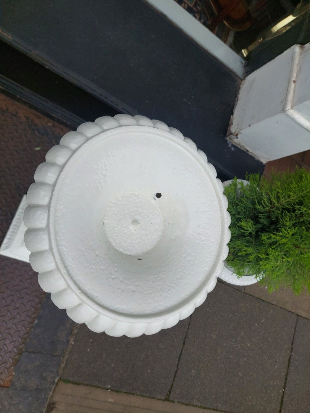A pair of late 19th-century white painted cast iron garden pedestals with turned column shafts and floral relief square bases. View III