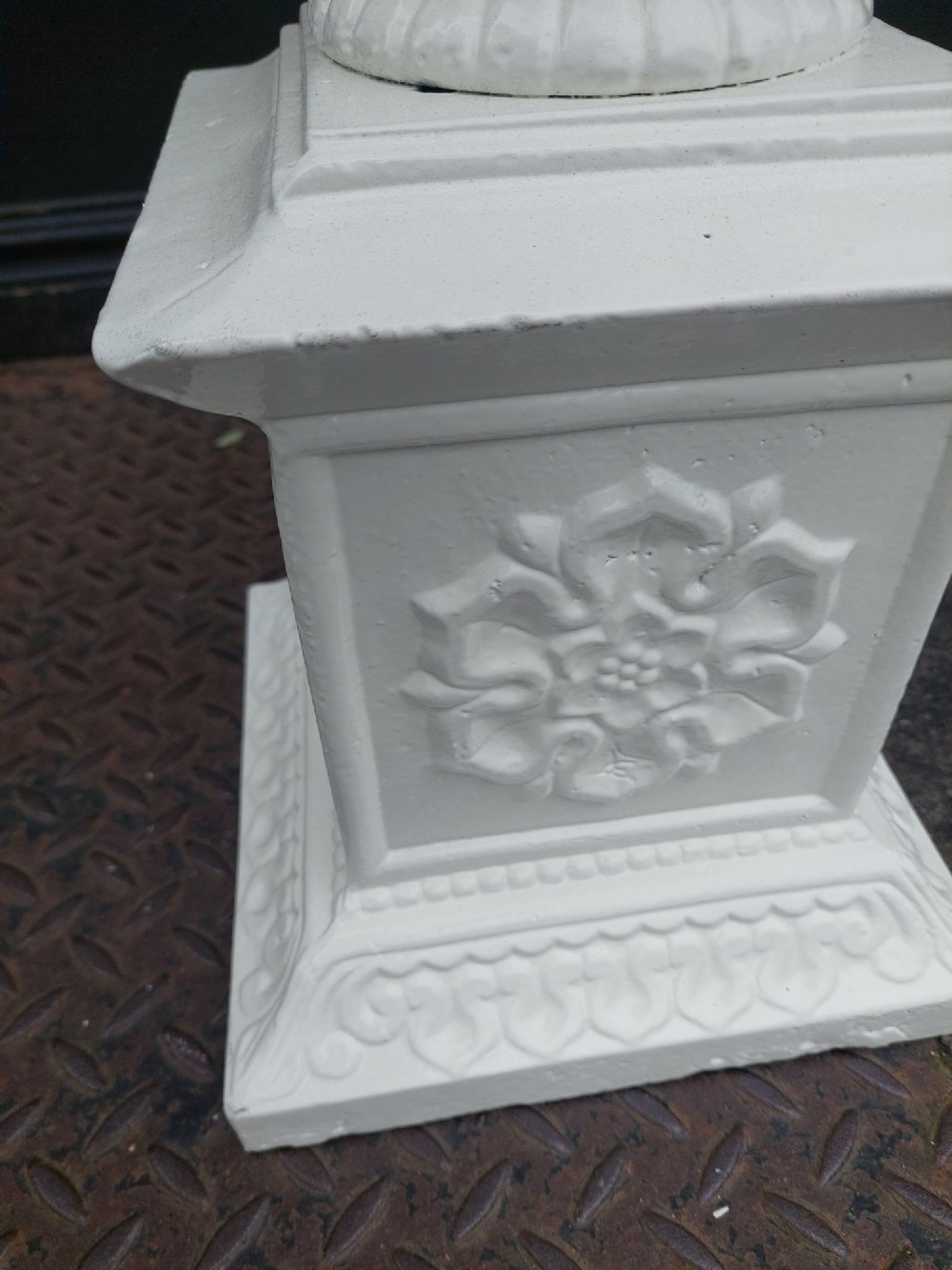 A pair of late 19th-century white painted cast iron garden pedestals with turned column shafts and floral relief square bases. View VIII