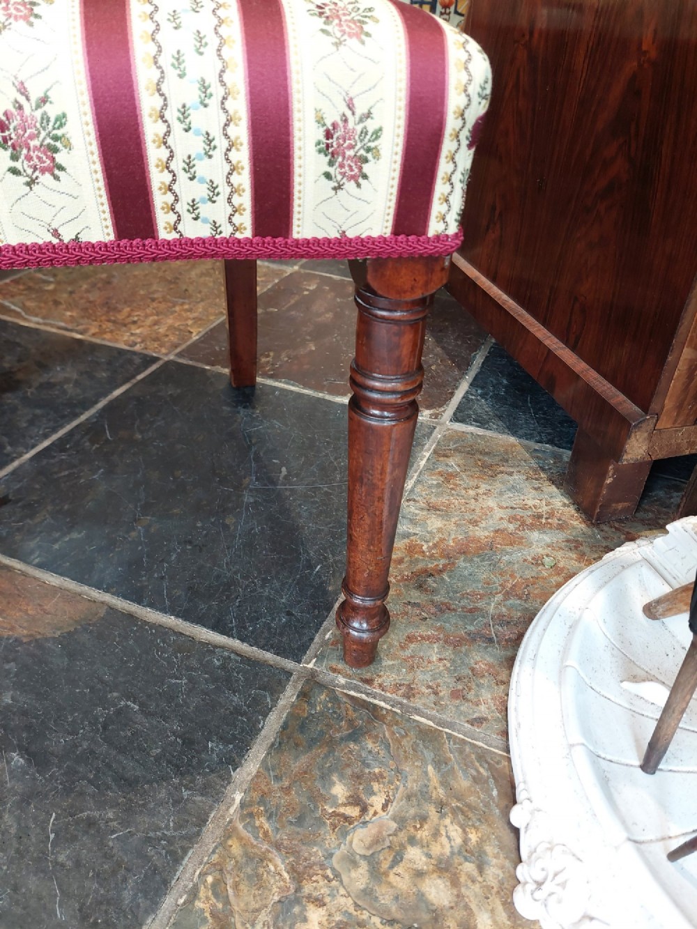 A Regency mahogany extendable dining table surrounded by matching dining chairs with striped upholstered seats. View IV