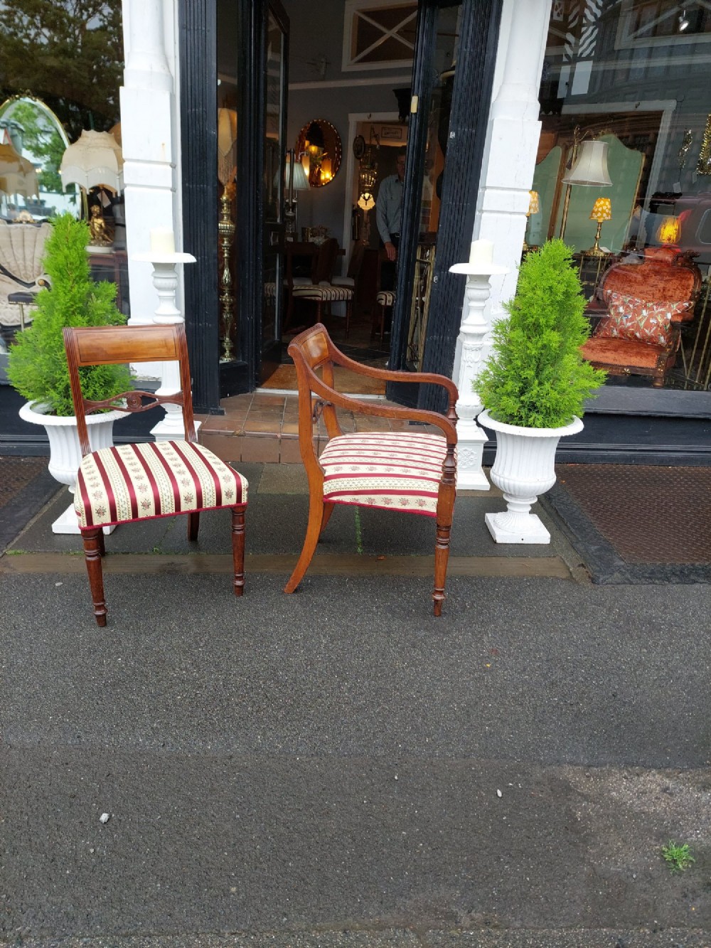 A Regency mahogany extendable dining table surrounded by matching dining chairs with striped upholstered seats. View VI