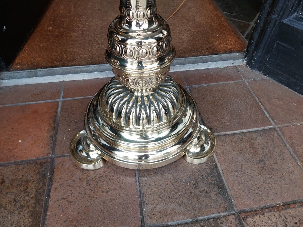 A Victorian brass extending standard floor lamp featuring a fluted column base and a deep red fabric shade with fringe detailing. View III