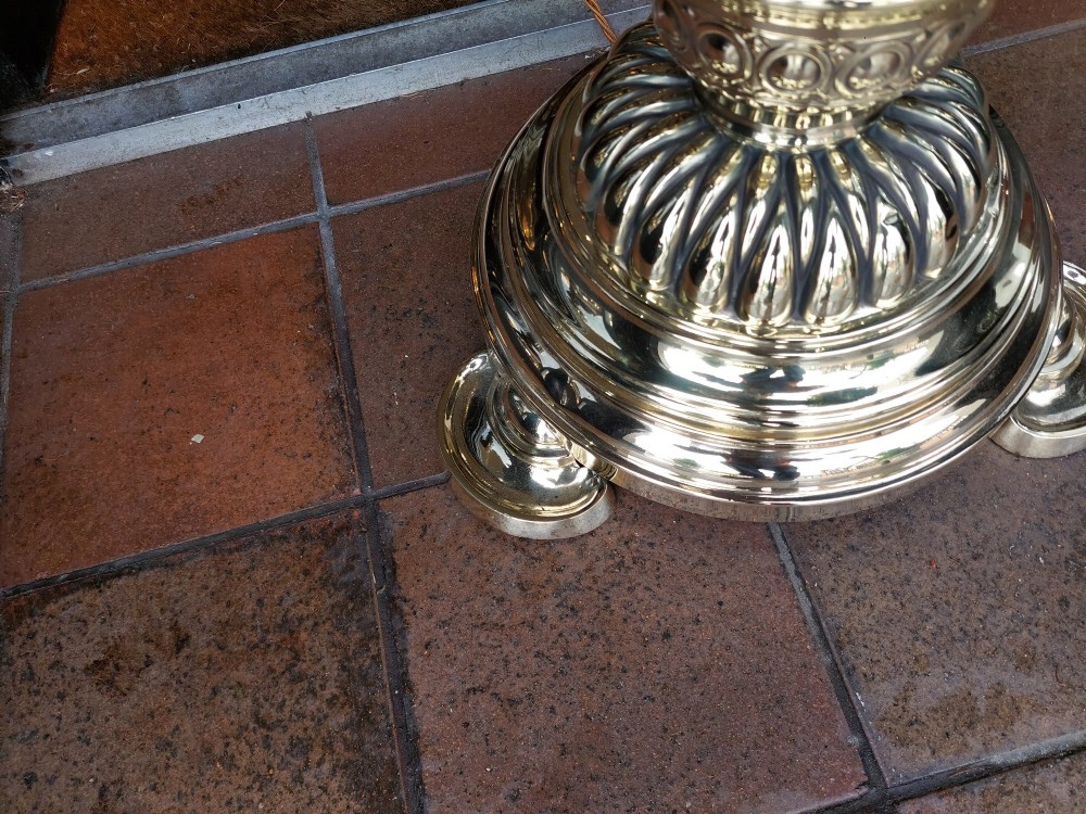 A Victorian brass extending standard floor lamp featuring a fluted column base and a deep red fabric shade with fringe detailing. View IV