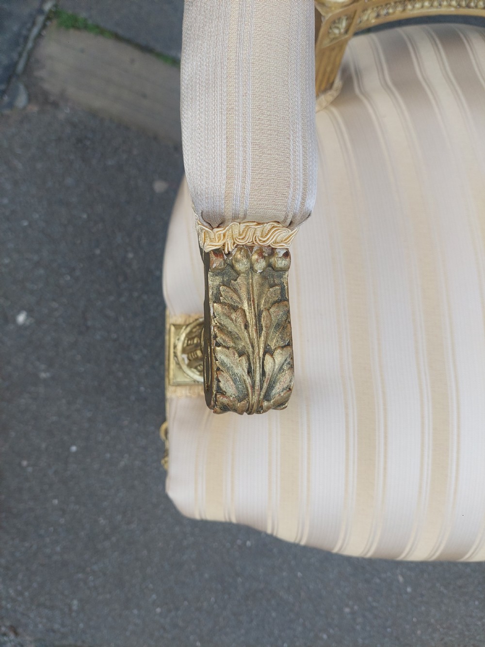 A mid-Victorian giltwood fauteuil armchair with carved golden wood framing, fluted legs, and cream striped upholstery. View III