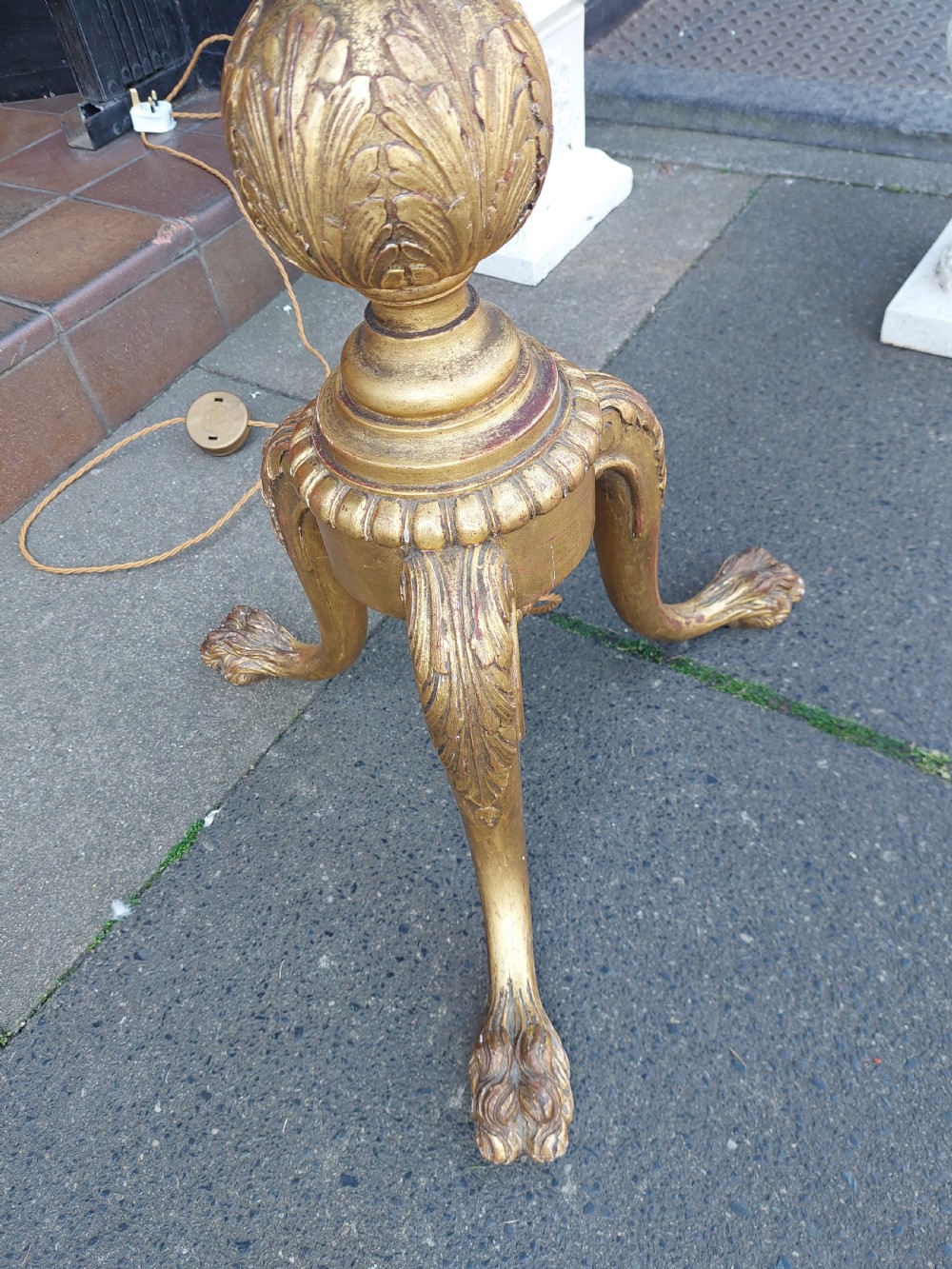 A tall Neoclassical giltwood standard lamp featuring a reeded column, an urn knop, carved tripod legs, and a fabric shade with tasselled fringe. View II