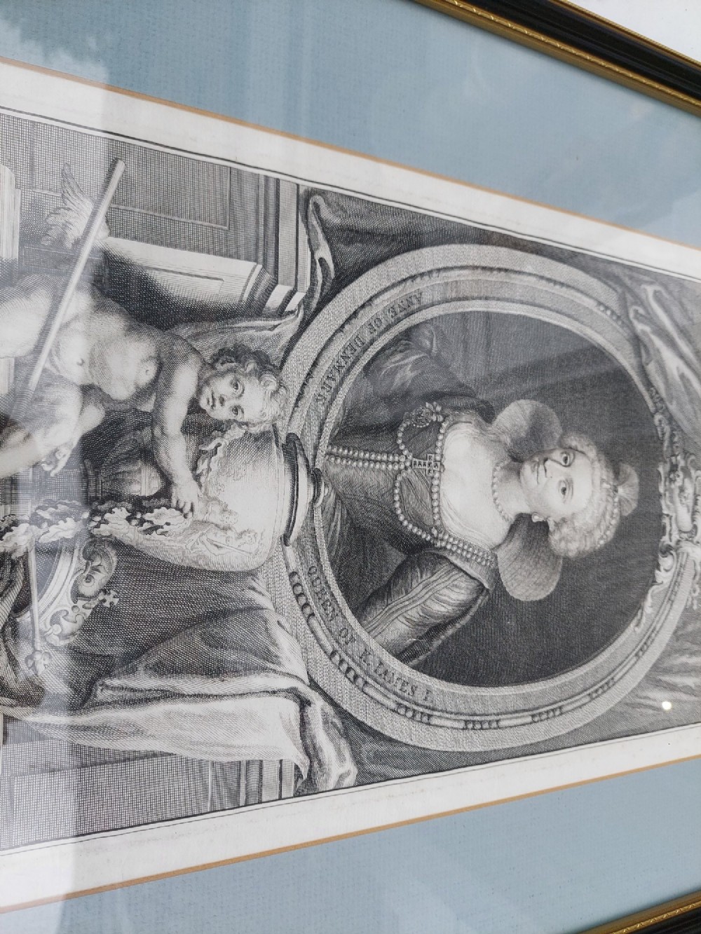 A pair of framed 18th-century line engravings by Jacobus Houbraken depicting oval portrait busts inside architectural surrounds with blue mounts and black frames. View IV