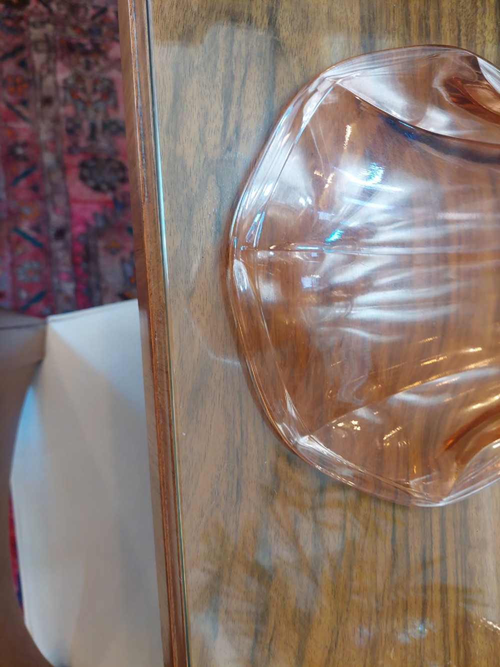 A translucent pink pressed glass vase featuring a flared fluted top supported by a figural stem and a hexagonal base. View III