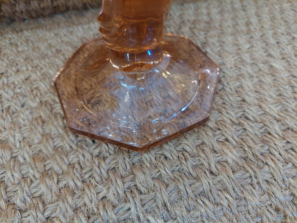 A translucent pink pressed glass vase featuring a flared fluted top supported by a figural stem and a hexagonal base. View VII