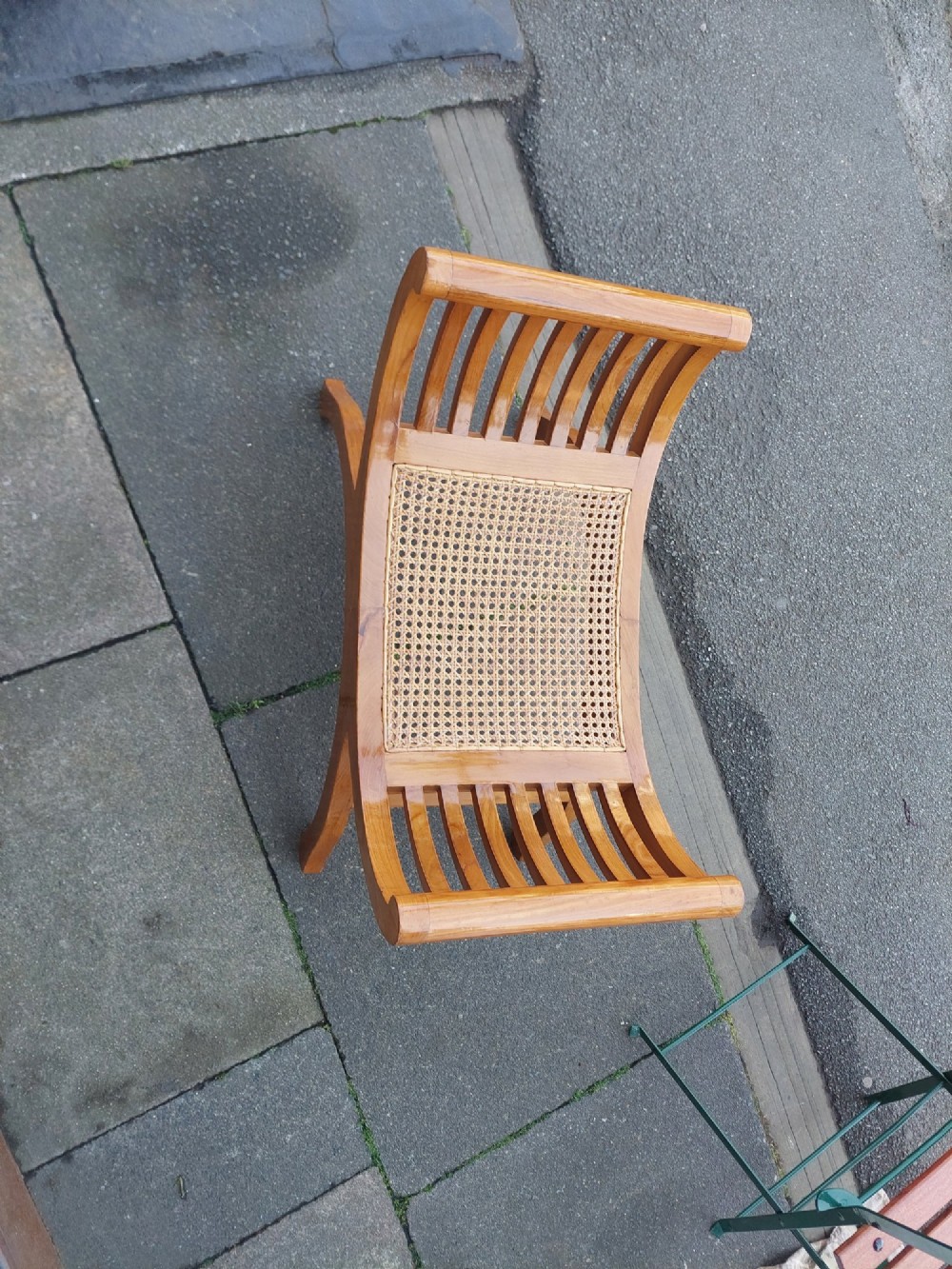 A late nineteenth-century golden satinwood dressing table stool featuring a curved X-frame design, slatted scroll armrests, and a central woven cane seat. View IV