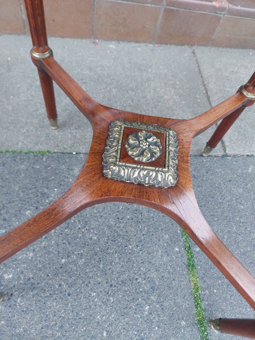 A mid-19th-century French Empire circular occasional table made of kingwood with a sunburst parquetry top and gilded metal mounts. View III