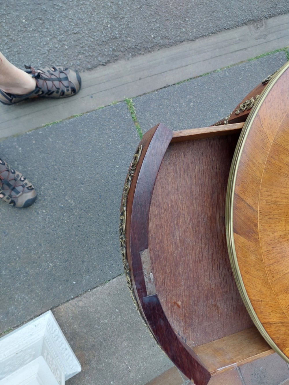 A mid-19th-century French Empire circular occasional table made of kingwood with a sunburst parquetry top and gilded metal mounts. View IX
