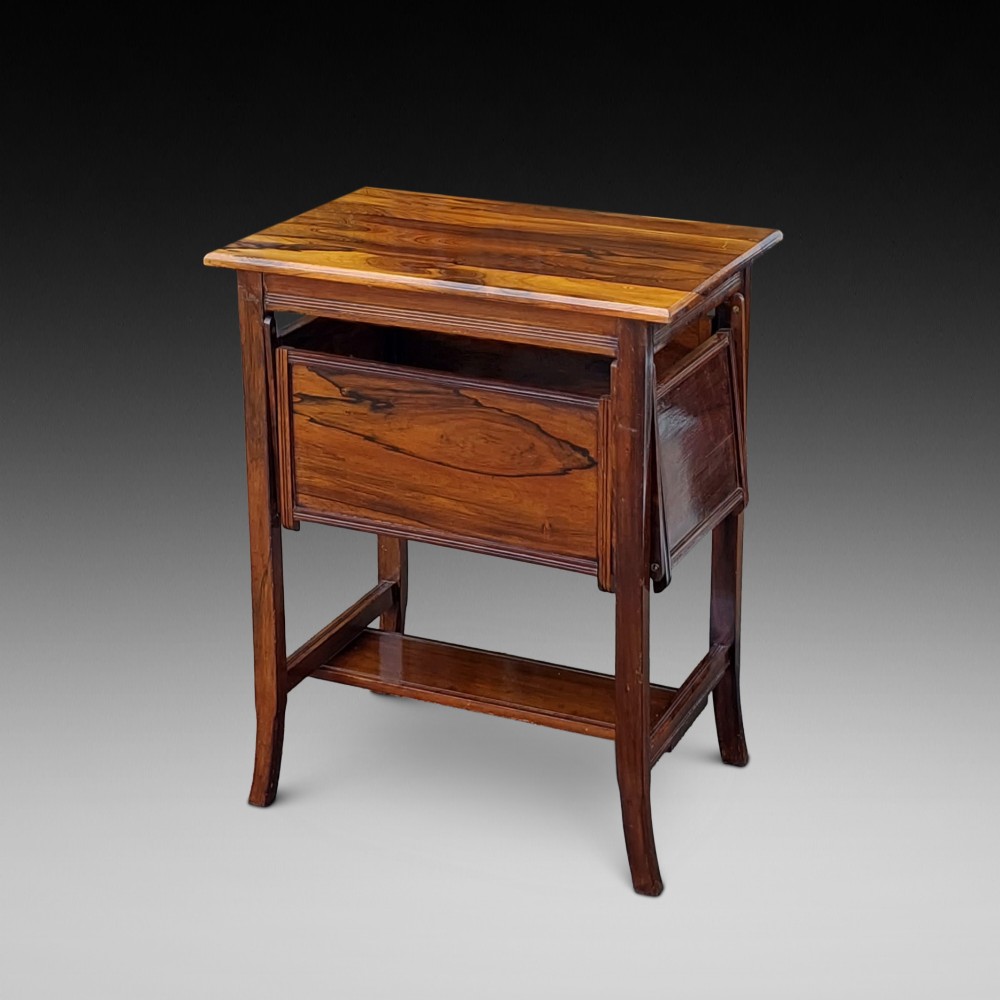 An Edwardian rosewood cake serving table featuring multiple drop-down folding side shelves and a polished rectangular top. View II