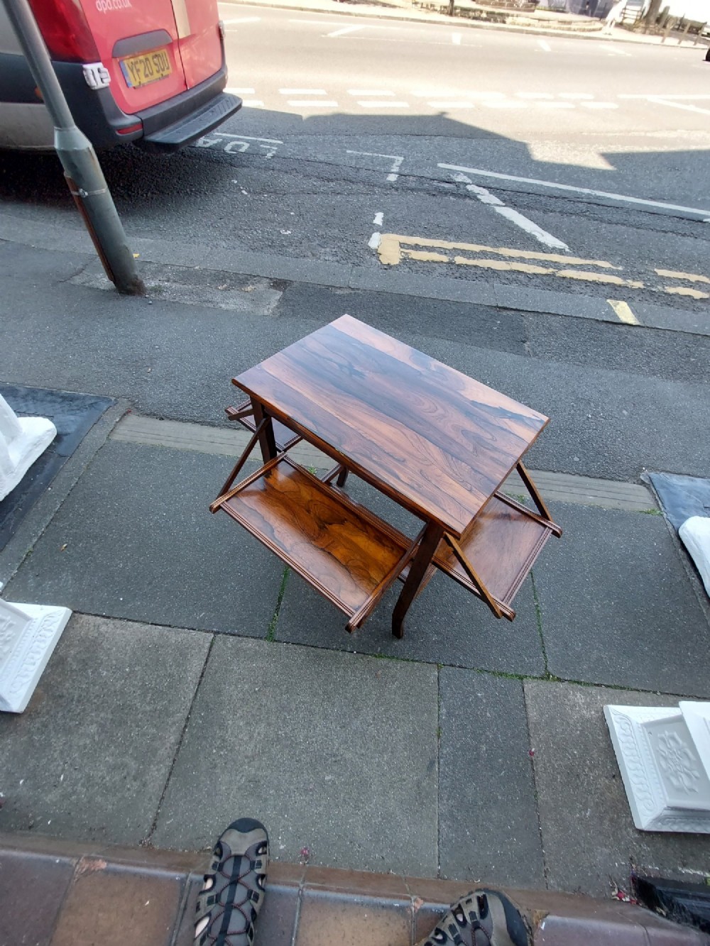An Edwardian rosewood cake serving table featuring multiple drop-down folding side shelves and a polished rectangular top. View V