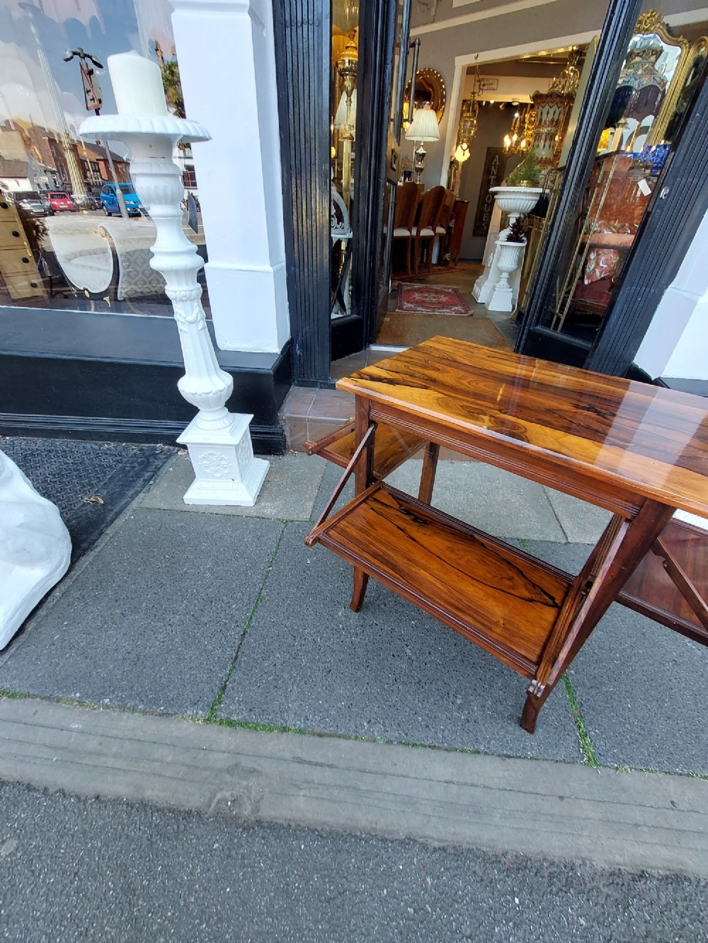 An Edwardian rosewood cake serving table featuring multiple drop-down folding side shelves and a polished rectangular top. View VIII