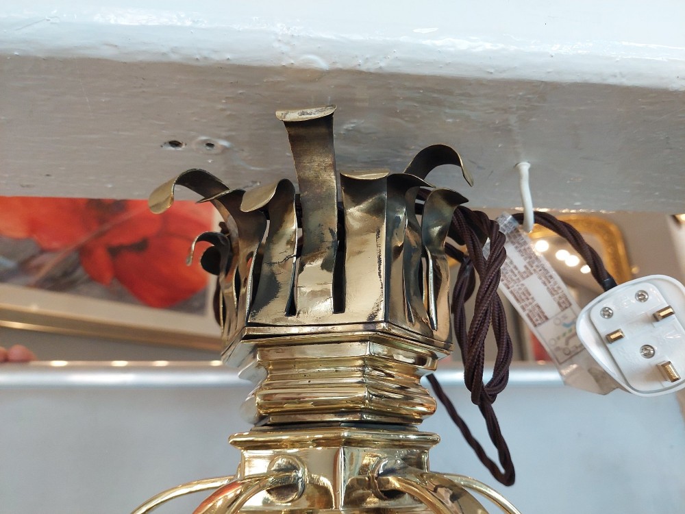 A hexagonal Victorian hanging brass lantern featuring glass panels, twisted corner columns, decorative scrollwork, and a central light bulb fitting. View IV