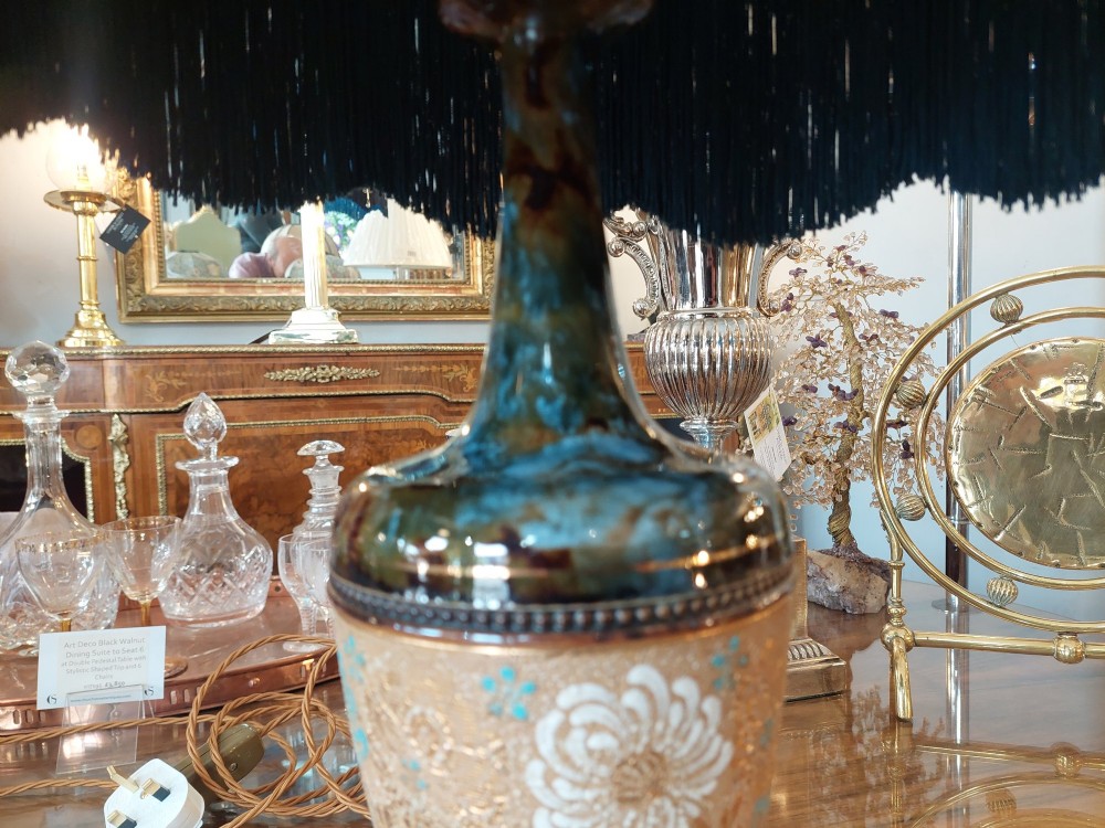 A pair of Royal Doulton Slaters Patent stoneware table lamps featuring patterned blue and gold ceramic bases paired with matching floral fringed fabric shades. View VII