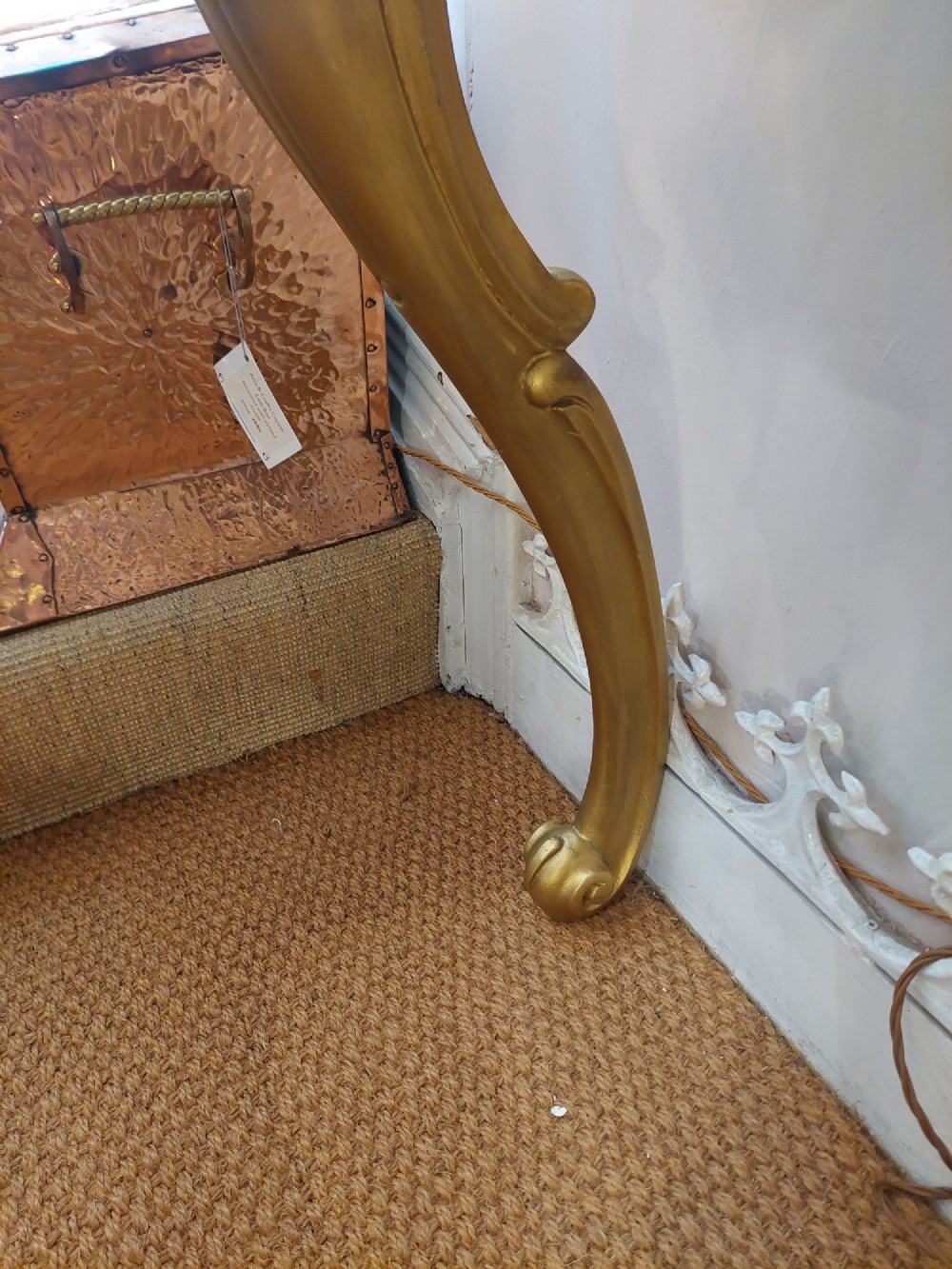 A tall late 19th-century French gilt gesso pier mirror featuring a rope-twist border and top ribbon motif, mounted above a small marble-topped single-leg console. View VIII