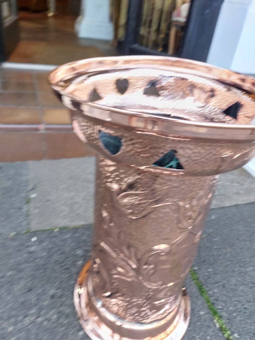 Cylindrical Art Nouveau copper umbrella stand with embossed organic relief motifs, a flared top rim, and a weighted base. View VIII