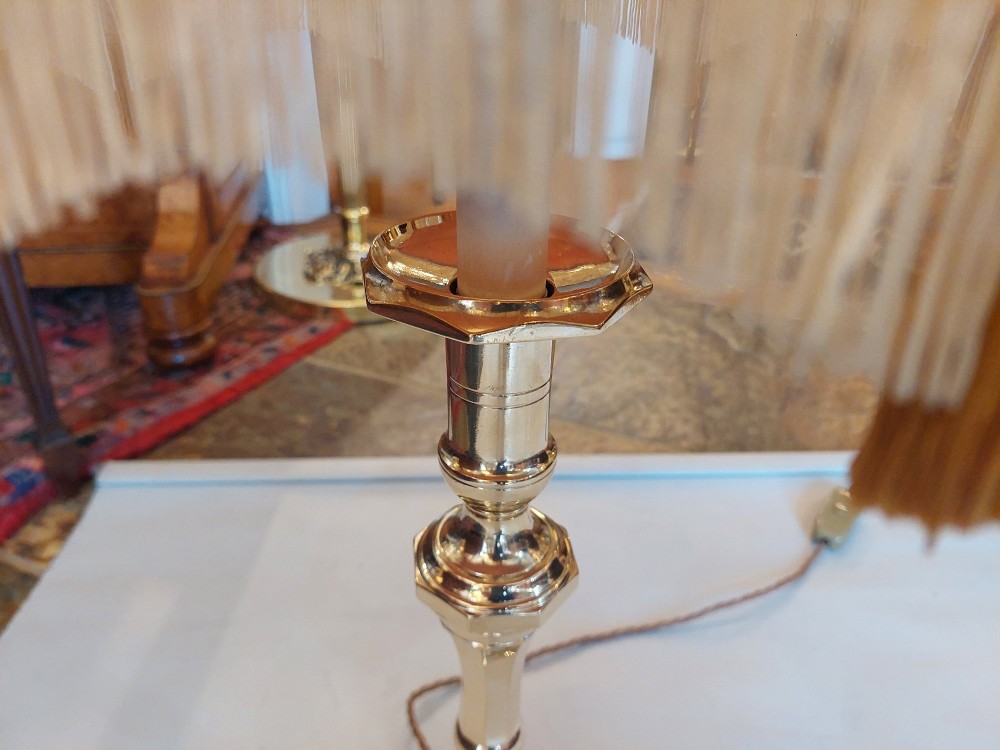 A Victorian turned brass candlestick table lamp featuring a rose pink embroidered lampshade with fringe and tassel trim. View IV