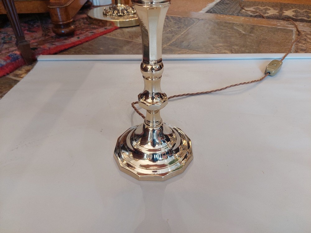 A Victorian turned brass candlestick table lamp featuring a rose pink embroidered lampshade with fringe and tassel trim. View V