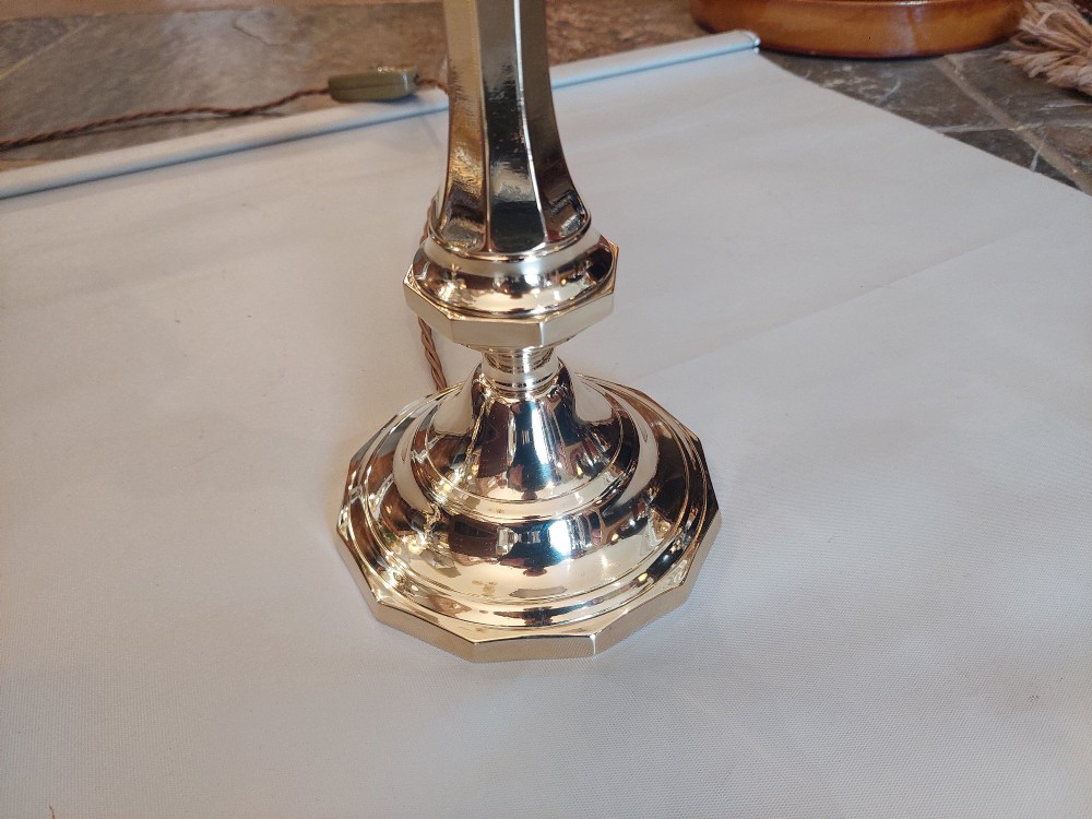 A pair of polished Victorian brass candlestick table lamps fitted with hexagonal beige fabric shades. View II
