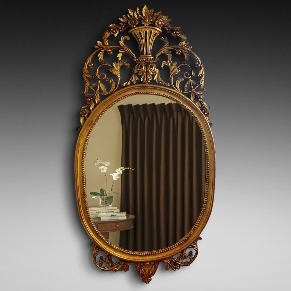 George III Carved Giltwood Oval Wall Mirror