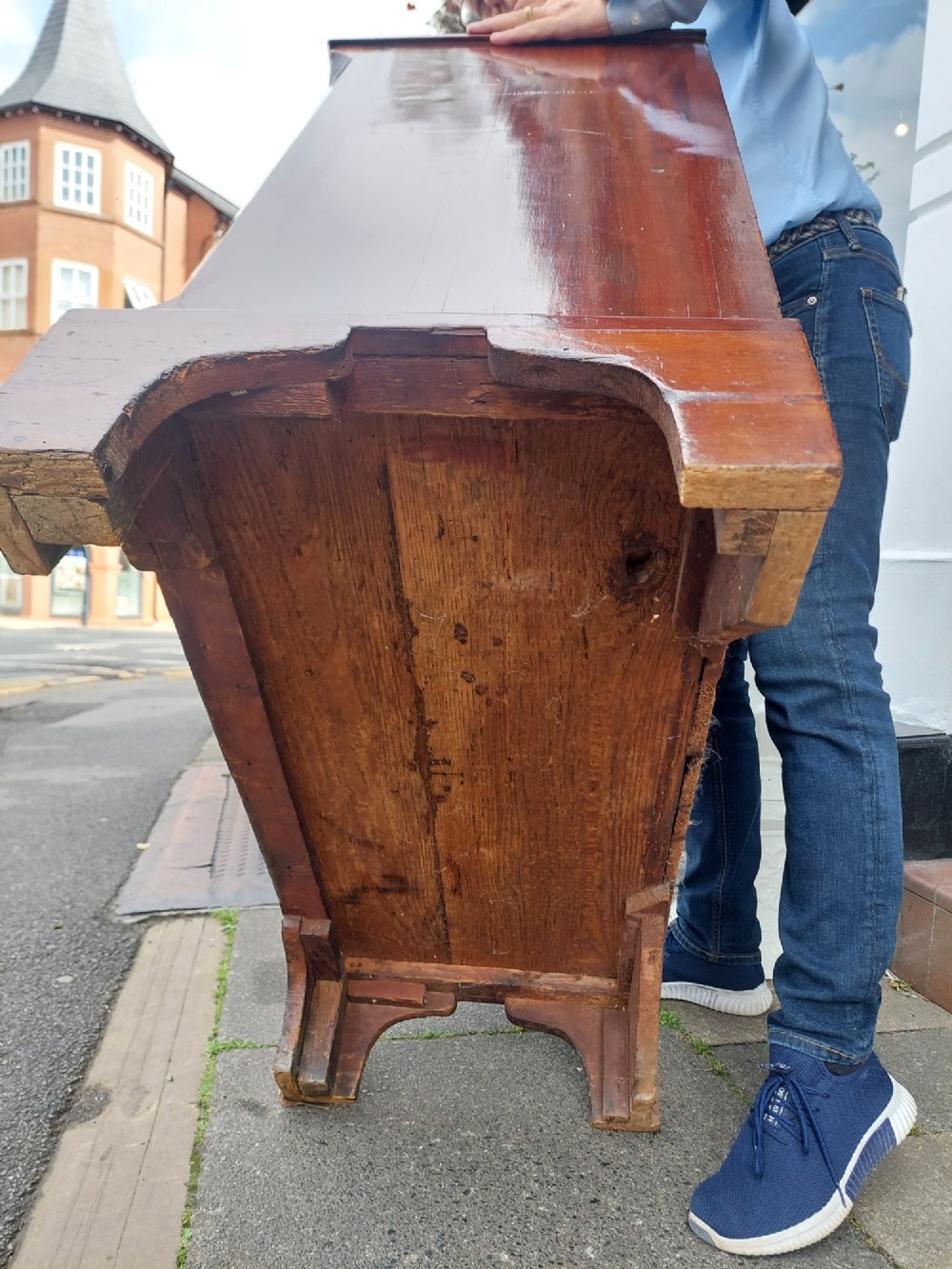 A George III mahogany bachelors chest featuring four graduated drawers, brass swan-neck handles, an upper pull-out brushing slide, and classic bracket feet. View XIII