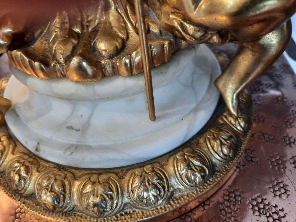 A three-piece antique lamp set featuring two tall standard lamps and one table lamp with ornate gilt cherub bases, alabaster spheres, and fringed cream domed shades. View XI