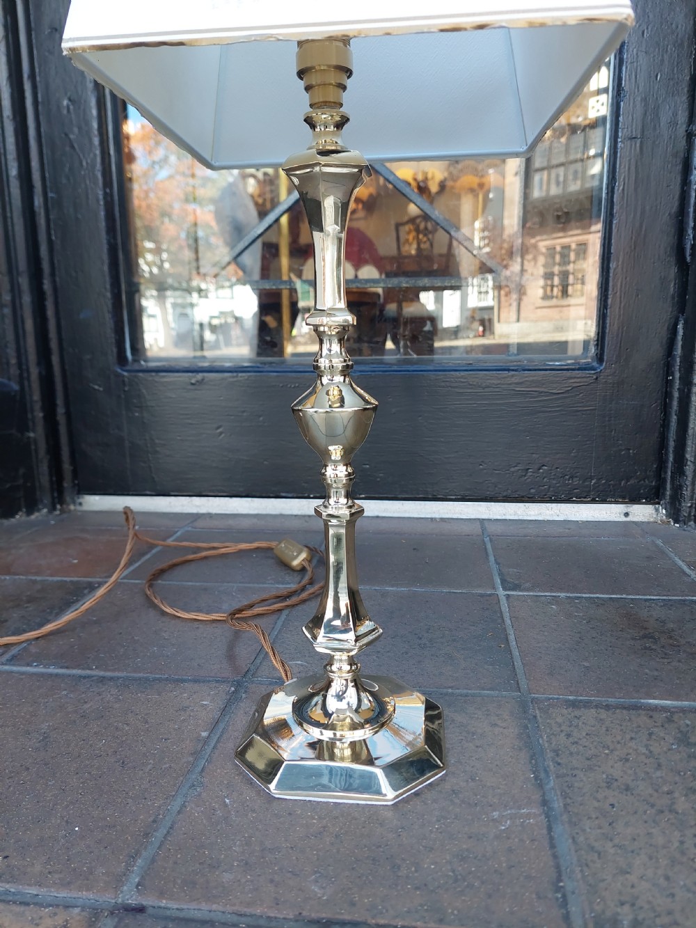 An Art Nouveau silvered brass table lamp featuring a hexagonal faceted stem and a white tapered shade printed with a pastoral scene. View VII