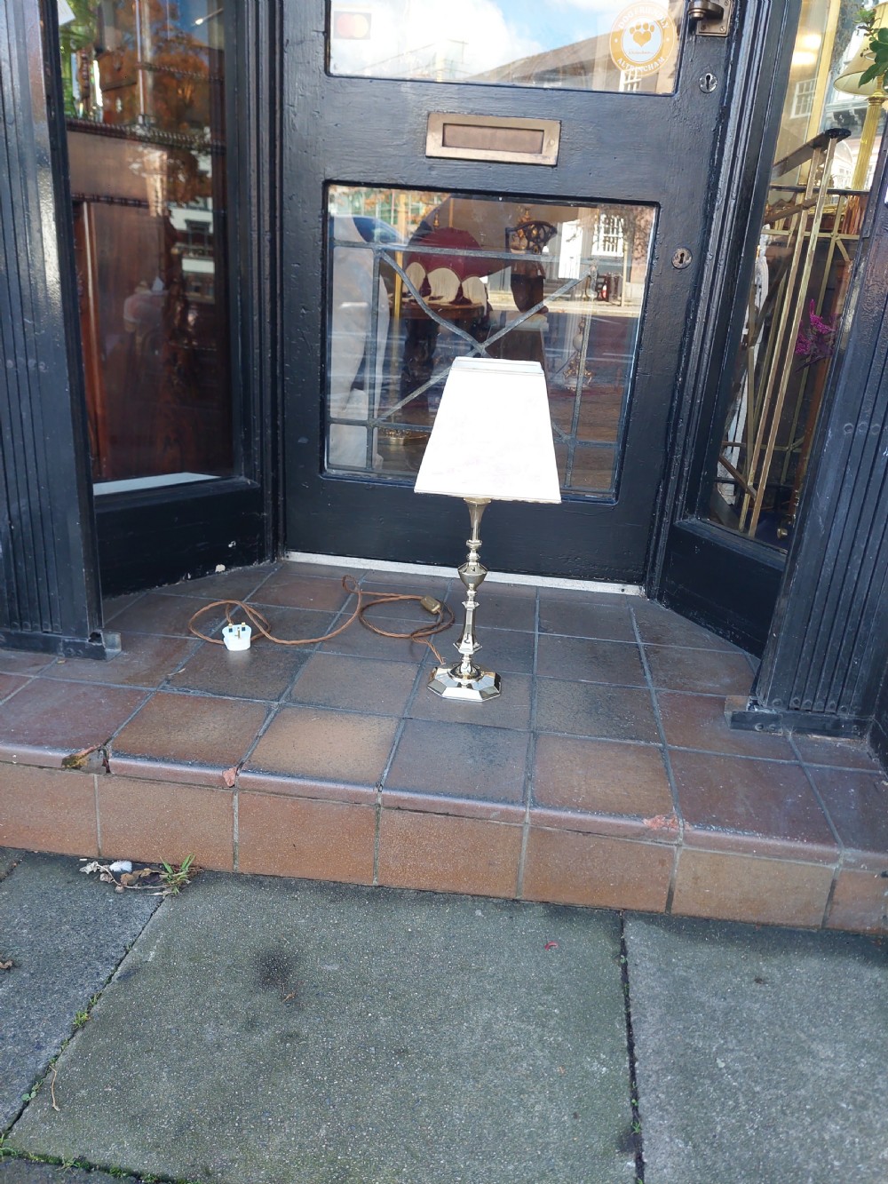 An Art Nouveau silvered brass table lamp featuring a hexagonal faceted stem and a white tapered shade printed with a pastoral scene. View X