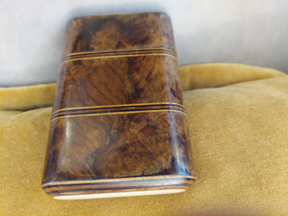 A late nineteenth-century pocket cigar case made from burr walnut with inlaid line detailing, shown partially open to reveal cigars inside. View VIII