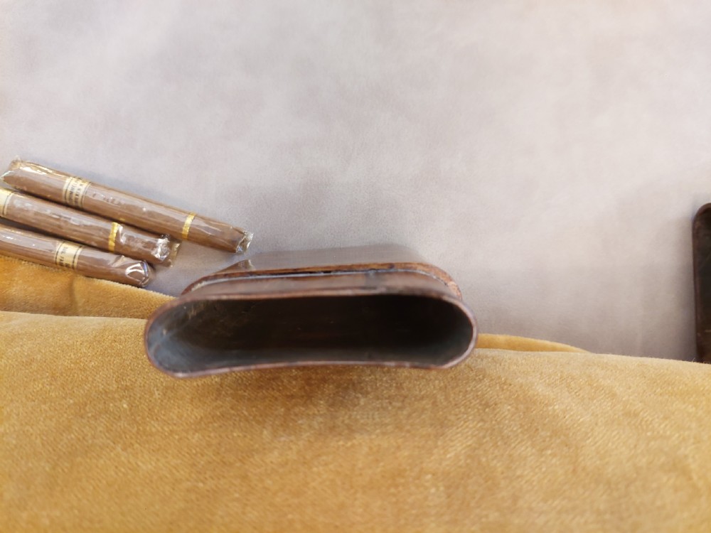 A late nineteenth-century pocket cigar case made from burr walnut with inlaid line detailing, shown partially open to reveal cigars inside. View IX