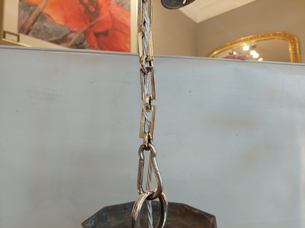 An early twentieth-century silver-plated six-arm ceiling chandelier featuring candle-style light sockets and a central fluted column. View V