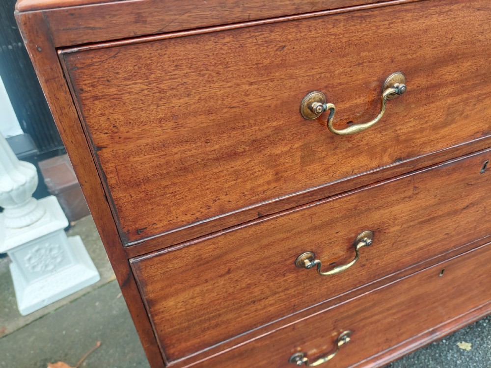 A late 18th-century Georgian mahogany tallboy chest on chest with brass swan-neck handles and bracket feet. View III