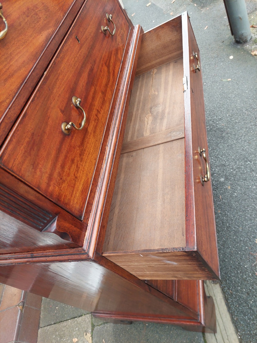 A late 18th-century Georgian mahogany tallboy chest on chest with brass swan-neck handles and bracket feet. View V