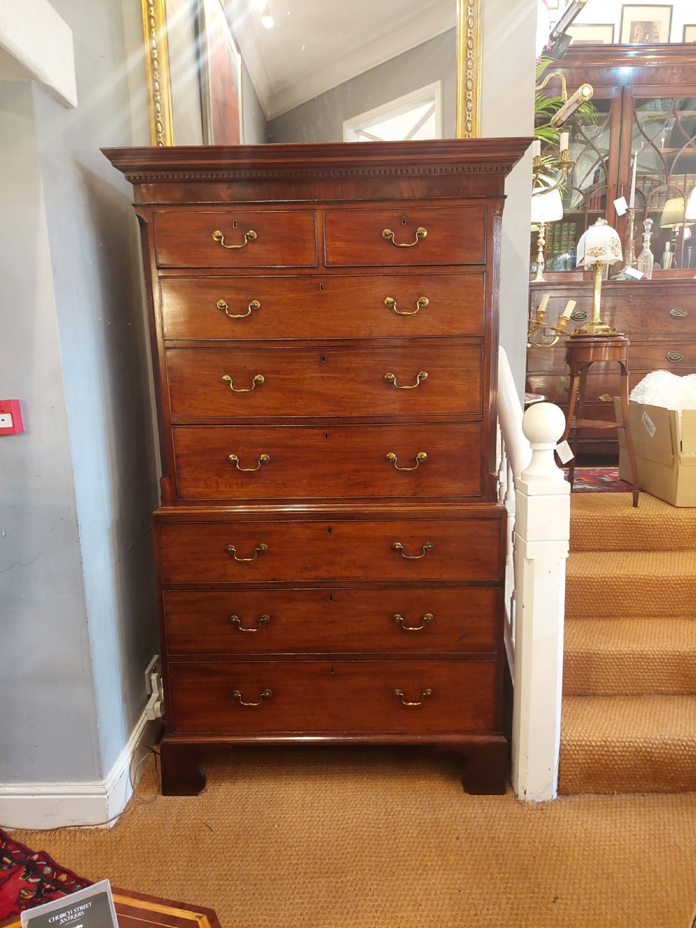 A late 18th-century Georgian mahogany tallboy chest on chest with brass swan-neck handles and bracket feet. View X