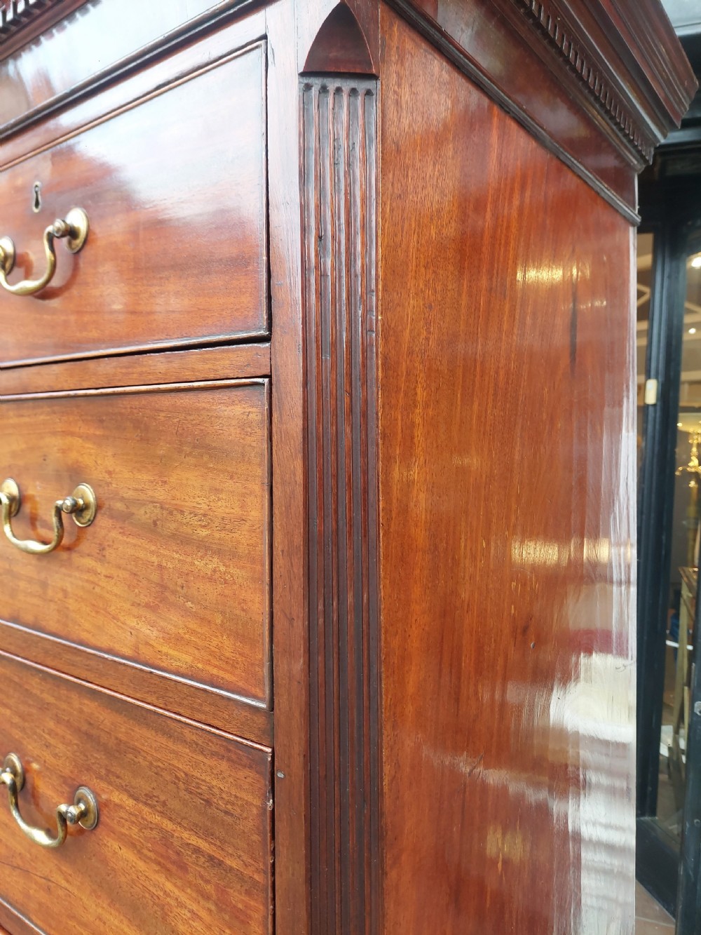 A late 18th-century Georgian mahogany tallboy chest on chest with brass swan-neck handles and bracket feet. View XIV