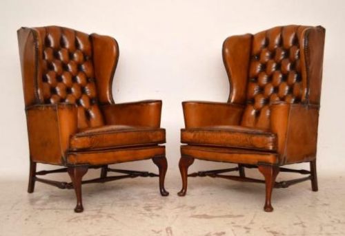 Pair of Antique Distressed Leather Wing Back Armchairs