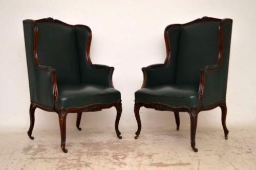 Pair of Antique Carved Mahogany Leather Wing Armchairs