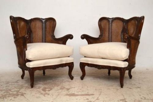 Pair of Antique Carved Walnut Cane Back Bergere Armchairs